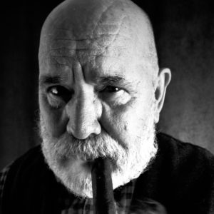 A B&W portrait of E.W. Doc Parris chomping on a cigar.