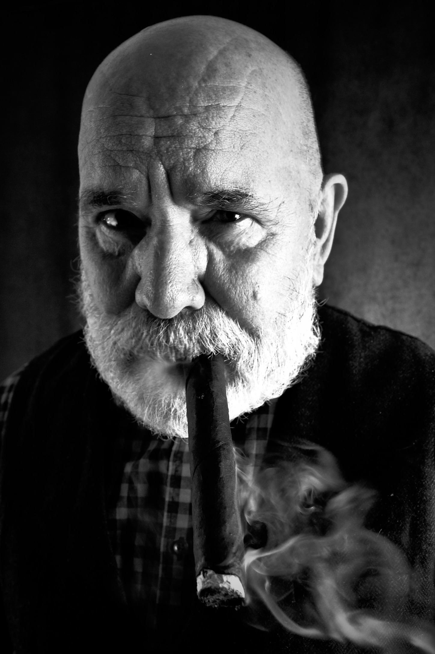 A B&W portrait of E.W. Doc Parris chomping on a cigar.