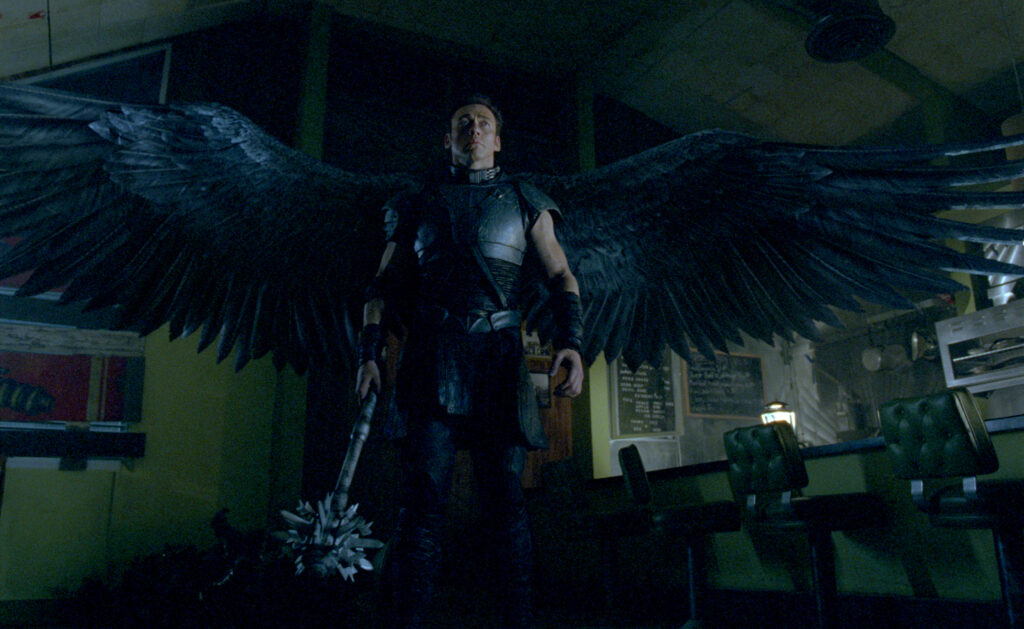 Kevin Durrand, as Gabriel, spreads his black wings.